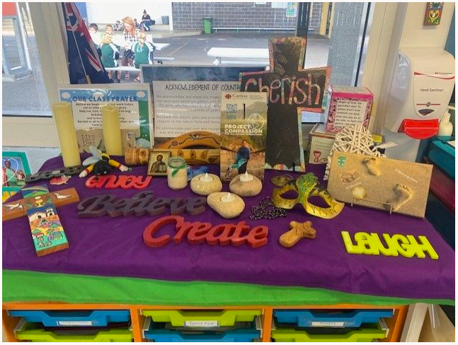 Classroom prayer and reflection table displaying faith symbols and values, supporting spiritual learning and reflection in everyday school life