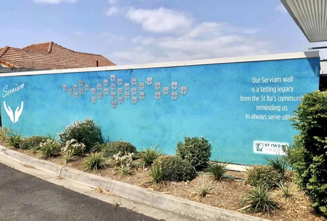 Serviam Wall at St Ita’s Catholic Primary School, showcasing a values artwork that reflects the school community’s commitment to service, faith and caring for others